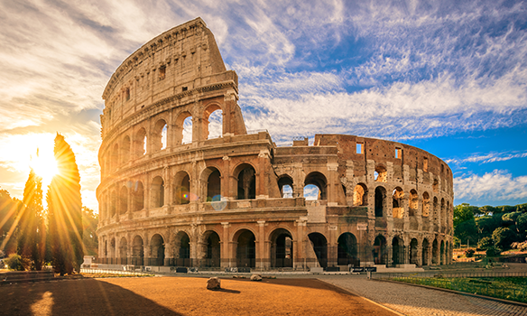 Rome Colosseum with the sun setting in the background  